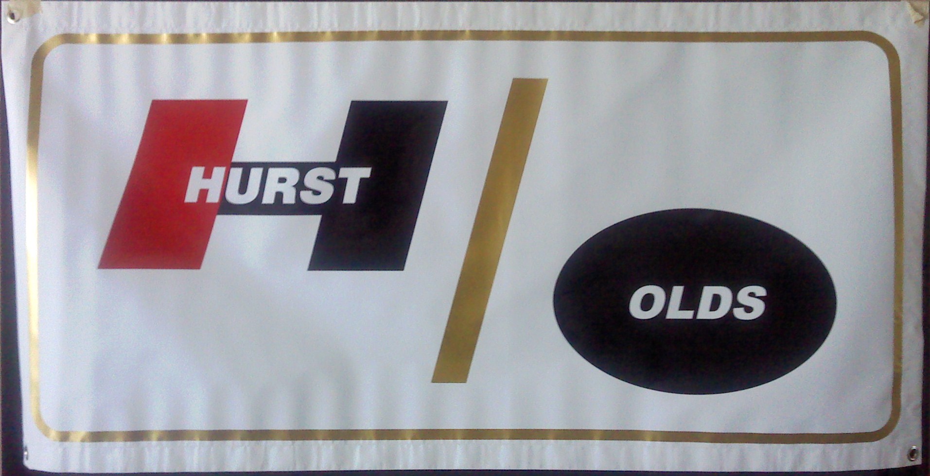 Officially Licensed Hurst Olds premium 13 oz vinyl banner white with red, gold and black lettering